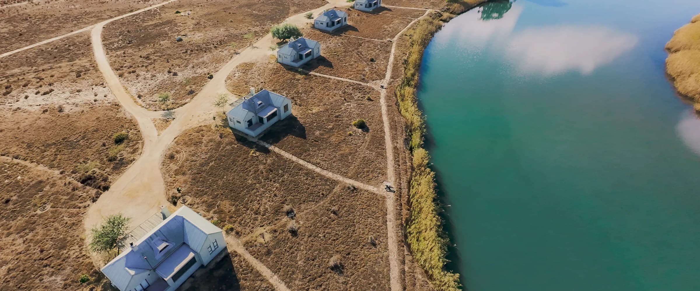 Aerial view of riverside chalets at Quagga River Lodge, South Africa
