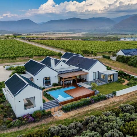 Villa surrounded by flowering fynbos at Benguela Cove
