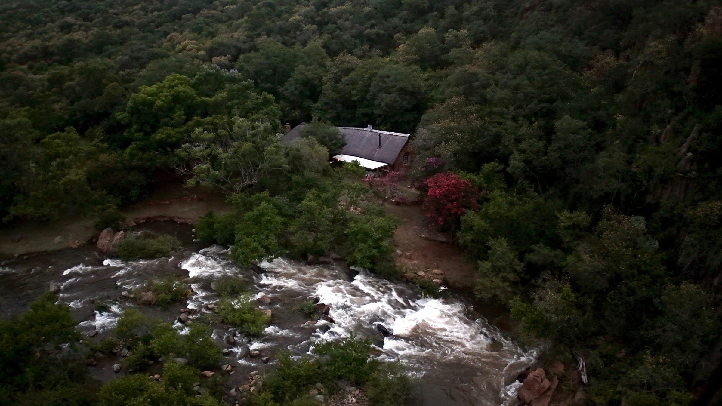 Drone view of the old stone farm cottage on the Spekboom Rivier outside Lydenburg, where the platform was named